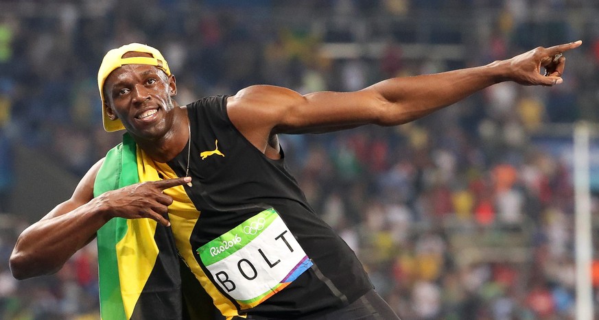 epa05485905 Usain Bolt of Jamaica celebrates after winning the men&#039;s 100m final of the Rio 2016 Olympic Games Athletics, Track and Field events at the Olympic Stadium in Rio de Janeiro, Brazil, 1 ...