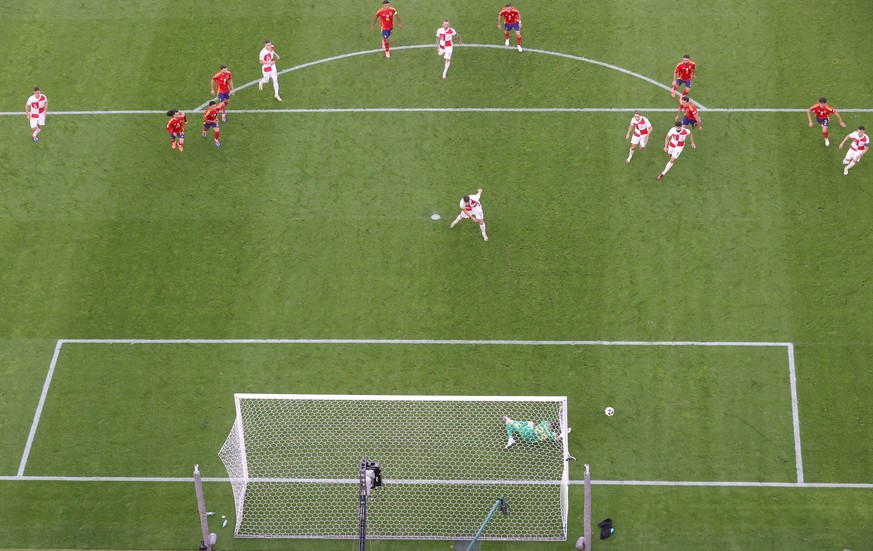 epa11413251 Bruno Petkovic of Croatia sees his penalty saved by goalkeeper Unai Simon of Spain during the UEFA EURO 2024 group B match between Spain and Croatia in Berlin, Germany, 15 June 2024. EPA/F ...