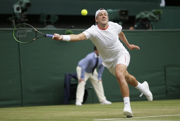 Lucas Pouile of France returns to Switzerland&#039;s Roger Federer in a Men&#039;s singles match during day six of the Wimbledon Tennis Championships in London, Saturday, July 6, 2019. (AP Photo/Tim I ...