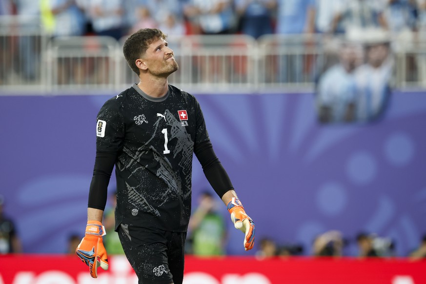 Switzerland's goalkeeper Gregor Kobel looks dejected after conceding the first goal during the World Cup quarter final match between Argentina and Switzerland at the Kansas City Stadium in Kansas ...