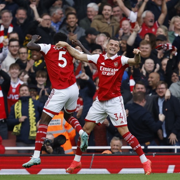 Arsenal&#039;s Thomas Partey, left celebrates with Arsenal&#039;s Granit Xhaka after scoring his sides 4th goal of the game during the English Premier League soccer match between, Arsenal and Nottingh ...
