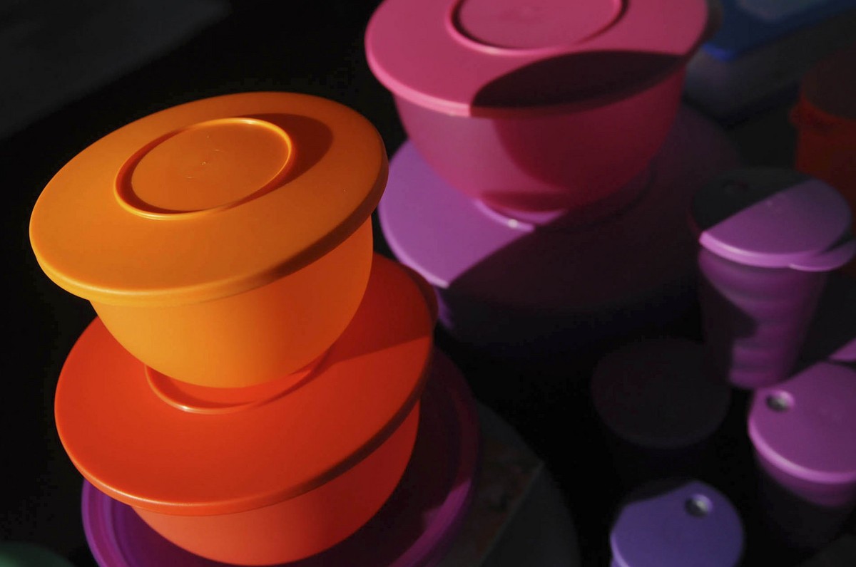 This Friday, Aug. 5, 2011 photo shows some of Kevin Farrell's colorful Tupperware products at a Tupperware party in Bellflower, Calif. Tupperware, it seems, is enjoying a renaissance 65 years aft ...