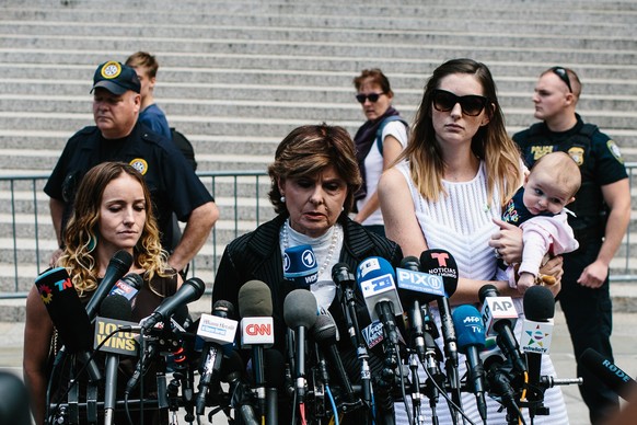epaselect epa07798181 Teala Davies (L), one of deceased financier Jeffrey Epstein&#039;s alleged victims, attorney Gloria Allred (C), and another unidentified alleged victim and her baby (R), speak to ...
