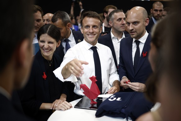 epa10690832 French President Emmanuel Macron (C) visits the Vivatech conference at Porte de Versailles exhibition center in Paris, France, 14 June 2023. VivaTech 2023 running from 14 to 17 June 2023 i ...