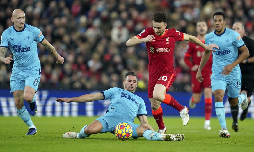 Liverpool&#039;s Diogo Jota, front right, duels for the ball with Newcastle&#039;s Fabian Schaer during the English Premier League soccer match between Liverpool and Newcastle United at Anfield stadiu ...