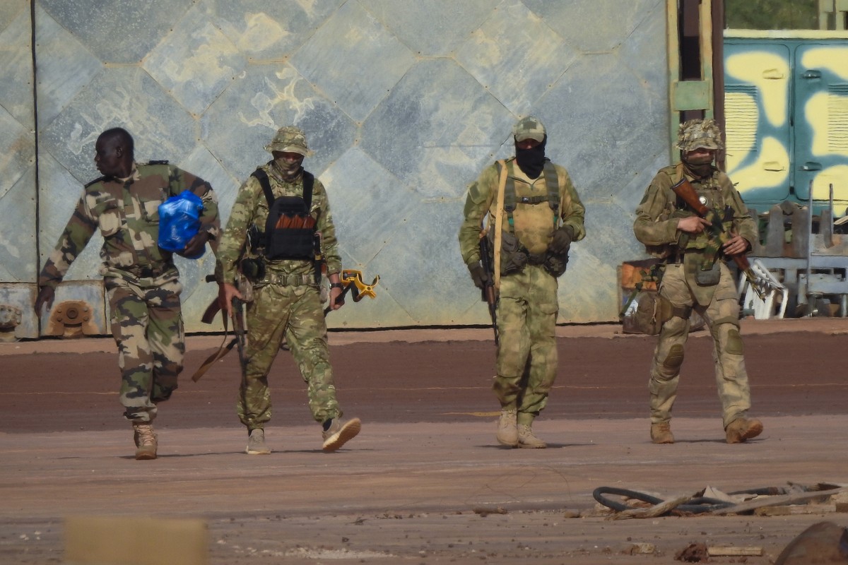 FILE - This undated photograph provided by the French military shows three Russian mercenaries, in northern Mali. Wagner is helping government forces in central and northern Mali carry out raids and d ...