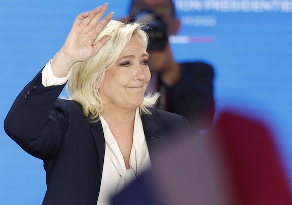 epa09907424 French presidential election candidate for the far-right Rassemblement National party candidate Marine Le Pen delivers a speech after being defeated in the second round of the French presi ...