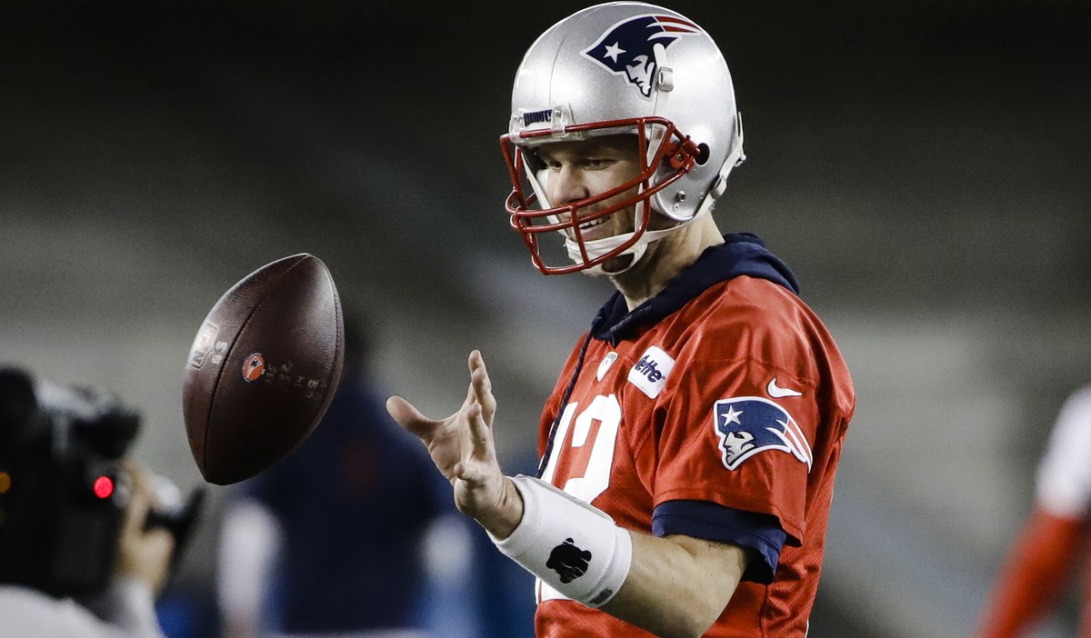 New England Patriots quarterback Tom Brady catches a ball during NFL football practice, Wednesday, Jan. 30, 2019, in Atlanta, as the team prepares for Super Bowl 53 against the Los Angeles Rams. (AP P ...