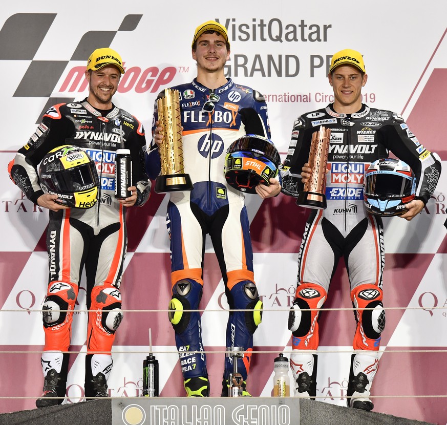 epa07427434 First placed Italian Moto2 rider Lorenzo Baldassarri (C) of Flexbox HP 40, second placed Swiss Moto2 rider Thomas Luthi (L) of Dynavolt Intact GP and third placed German Moto2 rider Marcel ...