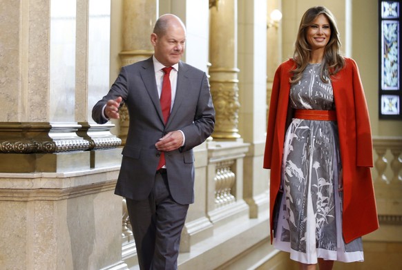 U.S. First Lady Melania Trump is greeted by Hamburg mayor Olaf Scholz, left, as she arrives at the town hall during the spouses program of the G20 summit in Hamburg, Germany Saturday, July 8, 2017. (A ...