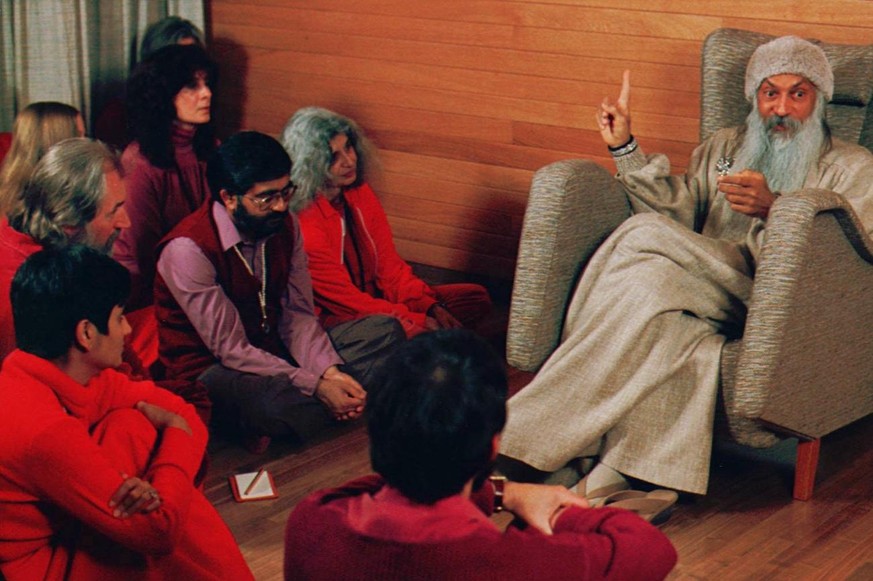 Bhagwan Shree Rajneesh, right, speaks with his disciples in this undated photo in Rajneeshpuram, Ore. Patrons of 10 restaurants in The Dalles, Ore., became ill in Sept. 1984, after being poisoned by m ...