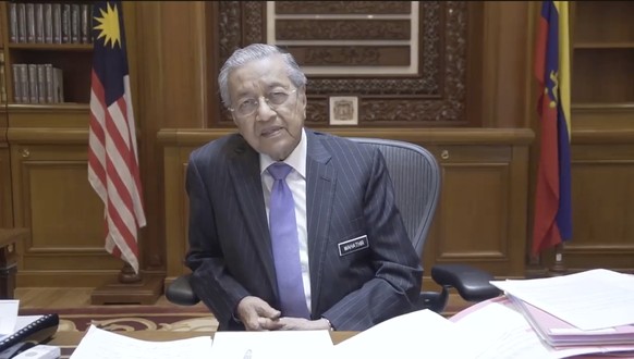 In this Thursday, Sept. 6, 2018, image made from Prime Minister Mahathir Mohamad&#039;s Facebook page, \ Malaysia&#039;s Prime Minister Mahathir speaks during a recording in Putrajaya, Malaysia. Malay ...