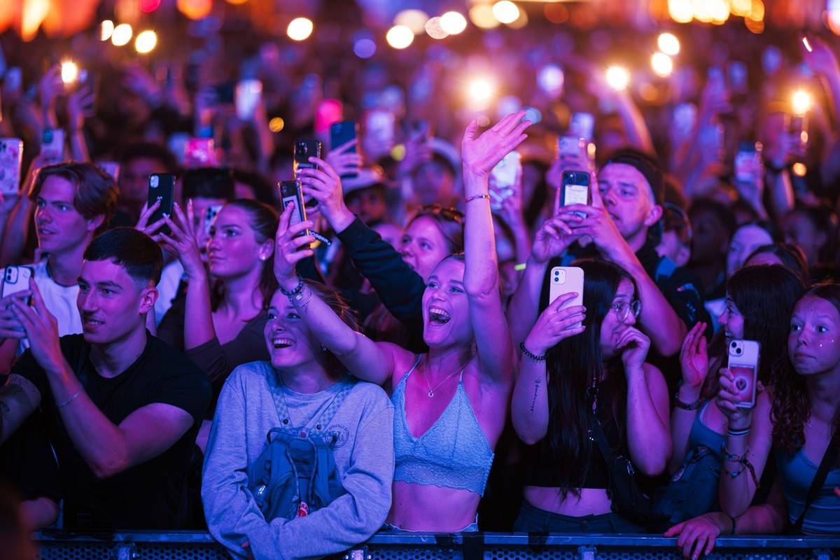 Festival goers cheer as French raper Josman performs on the Vega stage during the 46th edition of the Paleo Festival in Nyon, Switzerland, early Saturday, July 22, 2023. The Paleo is an open-air music ...