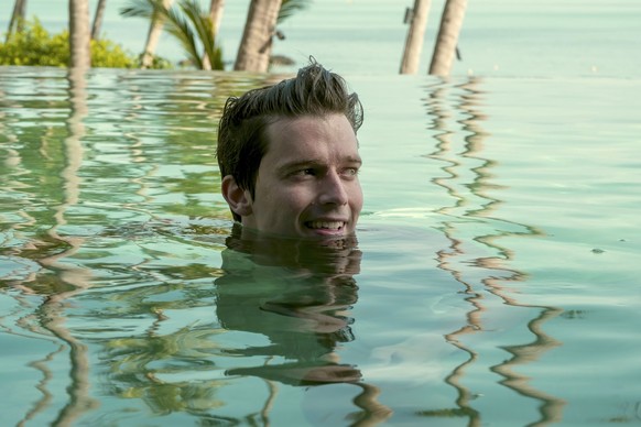 This image released by HBO shows Patrick Schwarzenegger in a scene from &quot;The White Lotus.&quot; (Fabio Lovino/HBO via AP)