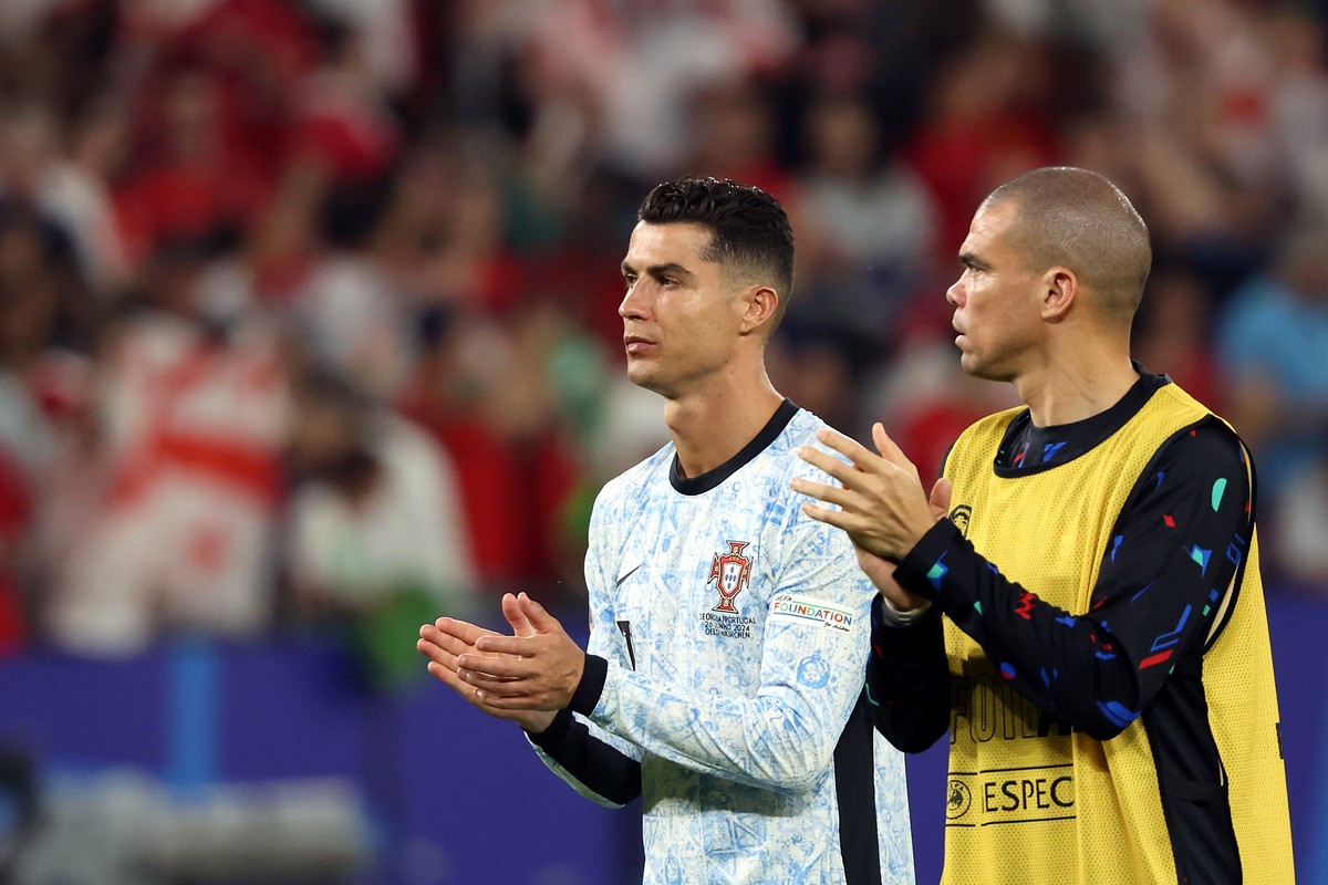 epa11440512 Cristiano Ronaldo of Portugal (L) and Pepe of Portugal react after losing the UEFA EURO 2024 group F soccer match between Georgia and Portugal, in Gelsenkirchen, Germany, 26 June 2024. EPA ...