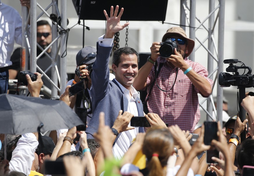 Venezuela’s self-proclaimed interim president Juan Guiado greets the crowd during an event to swear in nurses, doctors, professionals and others, as the group that will help with the arrival and distr ...