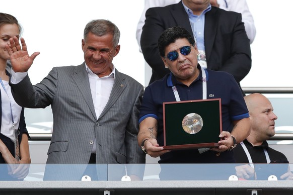 Argentinian soccer legend Diego Armando Maradona, right, gestures during the round of 16 match between France and Argentina, at the 2018 soccer World Cup at the Kazan Arena in Kazan, Russia, Thursday, ...
