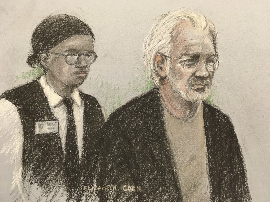 A court artist sketch by Elizabeth Cook of Wikileaks founder Julian Assange appearing at Westminster Magistrates Court, London, for an administrative hearing in London, Monday, Jan. 13, 2020. Assange  ...