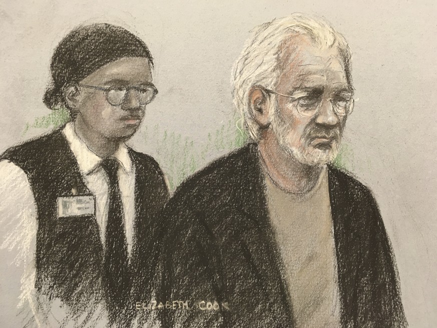 A court artist sketch by Elizabeth Cook of Wikileaks founder Julian Assange appearing at Westminster Magistrates Court, London, for an administrative hearing in London, Monday, Jan. 13, 2020. Assange ...