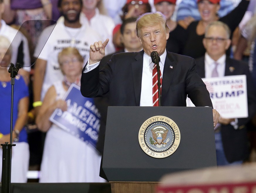 President Donald Trump speaks at a rally at the Phoenix Convention Center, Tuesday, Aug. 22, 2017, in Phoenix. (AP Photo/Rick Scuteri)