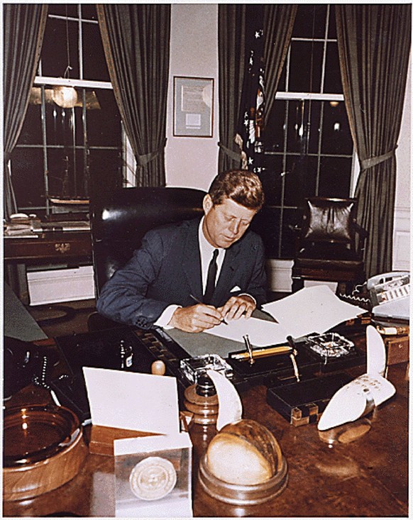 President Kennedy signs the Cuba Quarantine Proclamation on October 23, 1962.