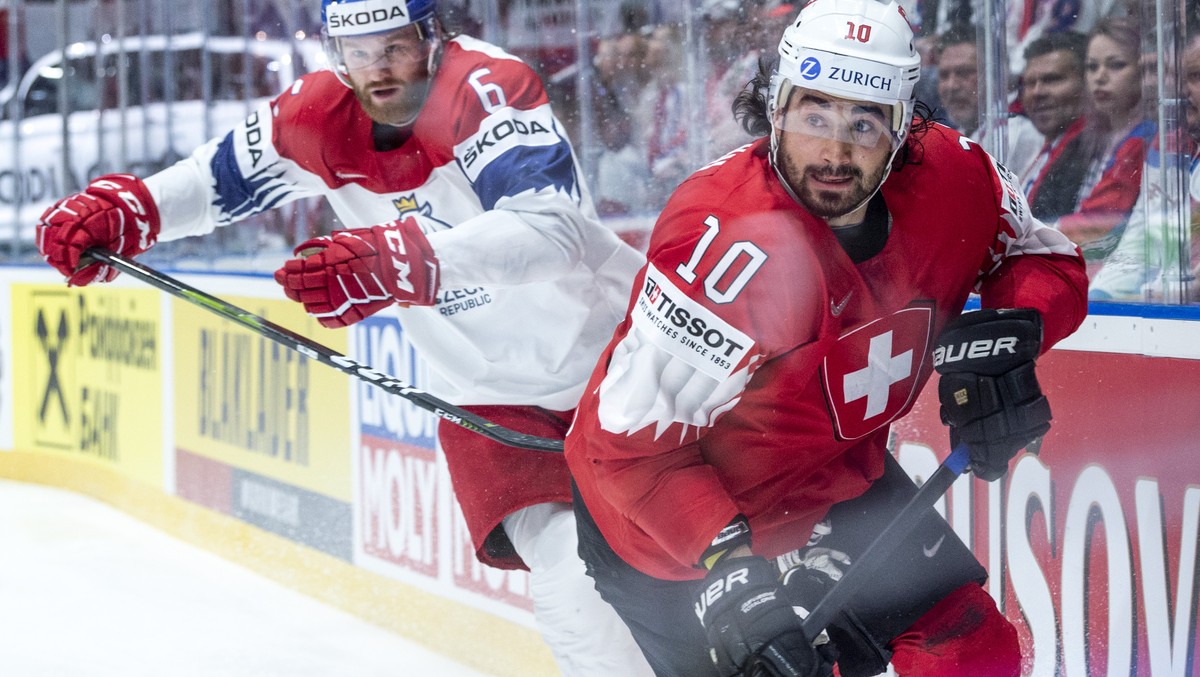 Czechy`s David Musil, left, against Switzerland's Andres Ambuehl during the game between Czech Republic and Switzerland, at the IIHF 2019 World Ice Hockey Championships, at the Ondrej Nepela Aren ...