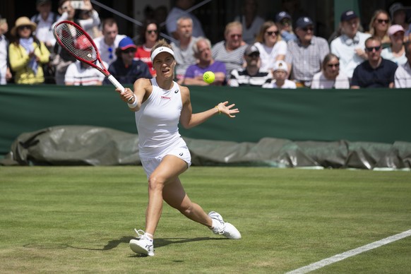 Viktorija Golubic of Switzerland in action during her first round match against Iga Swiatek of Poland, at the All England Lawn Tennis Championships in Wimbledon, London, on Monday, July 1, 2019.(KEYST ...