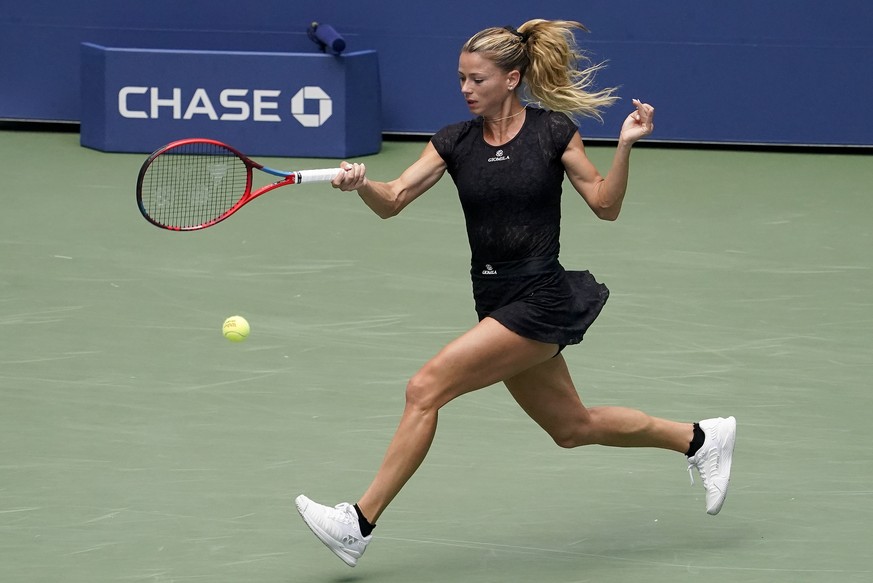 Camila Giorgi, of Italy, returns a shot to Madison Keys, of the United States, during the second round of the US Open tennis championships, Wednesday, Aug. 31, 2022, in New York. (AP Photo/John Minchi ...