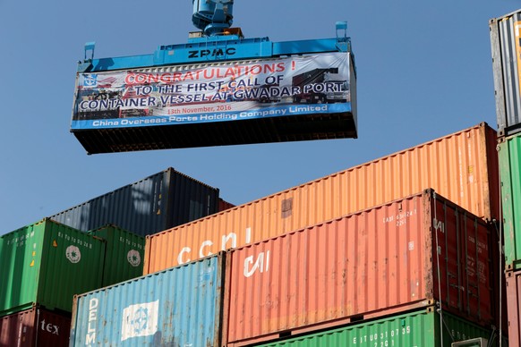 FILE PHOTO: A container is loaded on to the first Chinese container ship to depart after the inauguration of the China Pakistan Economic Corridor port in Gwadar, Pakistan November 13, 2016. REUTERS/Ca ...