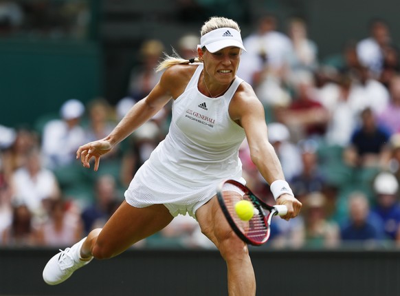 epa06065275 Angelique Kerber of Germany returns to Irina Falconi of Italy in their first round match during the Wimbledon Championships at the All England Lawn Tennis Club, in London, Britain, 04 July ...