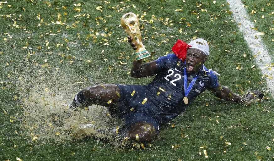 France&#039;s Benjamin Mendy celebrates with the trophy after his team won the final match against Croatia at the 2018 soccer World Cup in the Luzhniki Stadium in Moscow, Russia, on July 15, 2018. (AP ...