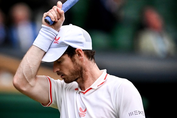 epa09319112 Andy Murray of Britain reacts during the 3rd round match against Denis Shapovalov of Canada at the Wimbledon Championships, Wimbledon, Britain 02 July 2021. EPA/NEIL HALL EDITORIAL USE ONL ...