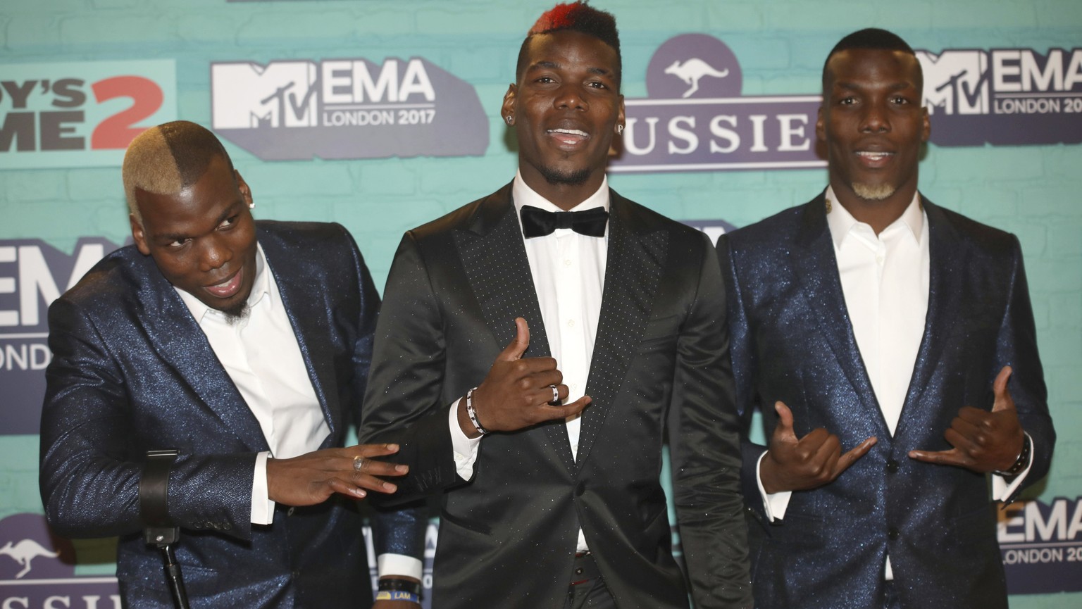 Soccer players Mathias Pogba, from left, Paul Pogba and Florentin Pogba poses for photographers upon arrival at the MTV European Music Awards 2017 in London, Sunday, Nov. 12th, 2017. (Photo by Vianney ...