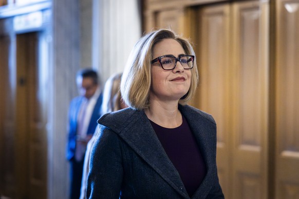 epa11148252 Independent Arizona Senator Kyrsten Sinema walks to the Senate ahead of a procedural vote on a standalone foreign aid package for Ukraine and Israel, without any contiguous borders...