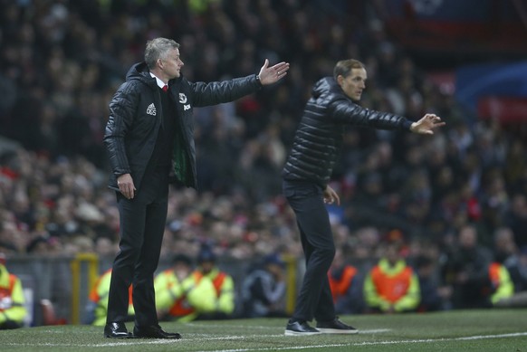 Manchester United&#039;s manager Ole Gunnar Solskjaer, left andParis Saint Germain&#039;s coach Thomas Tuchel gesture to their players from the sidelines during the Champions League round of 16 soccer ...