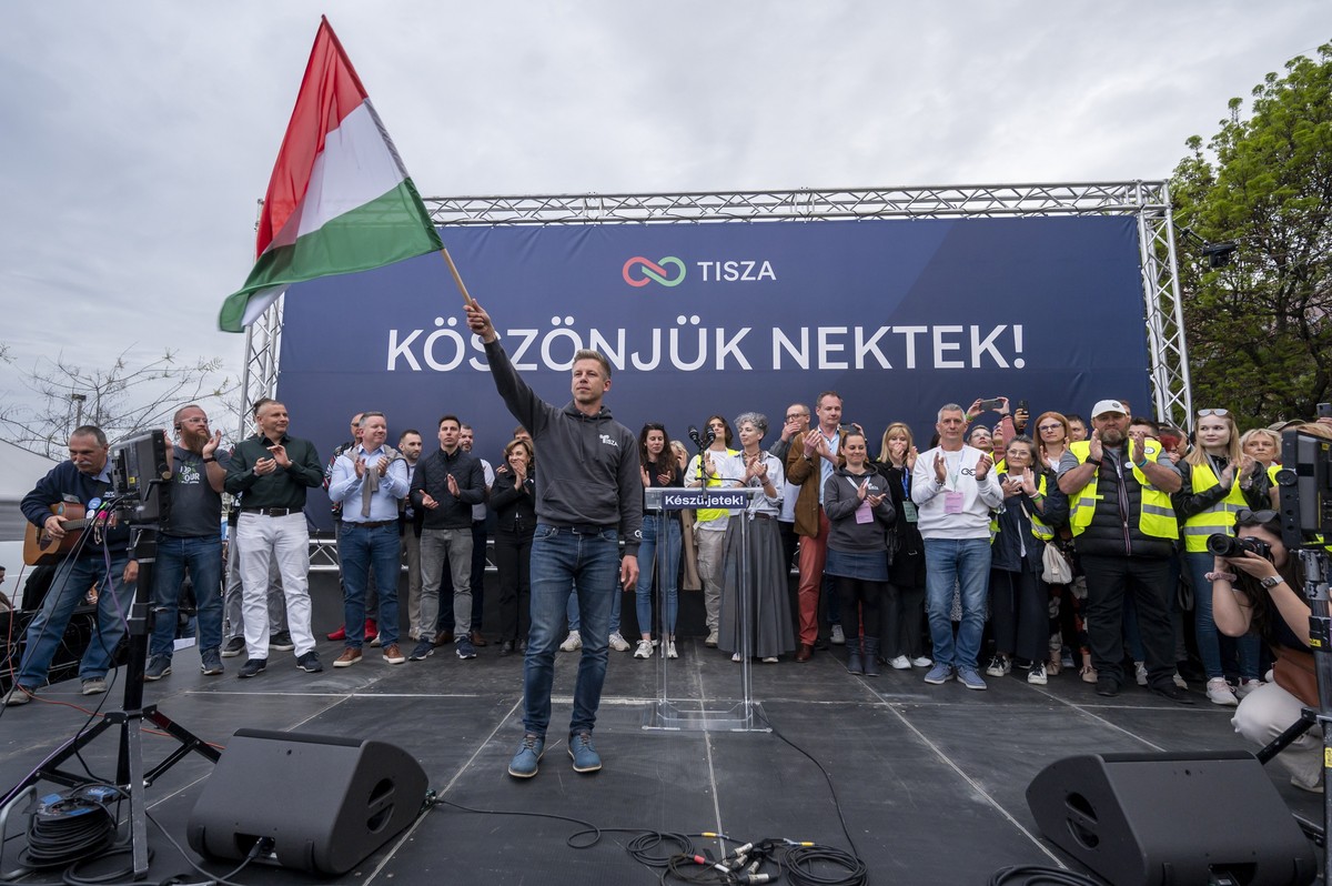 epa12030541 Leader of the Hungarian opposition Tisza Party Peter Magyar waves a Hungarian flag before the results of the party's public survey entitled 'Voice of the Nation' are announc ...