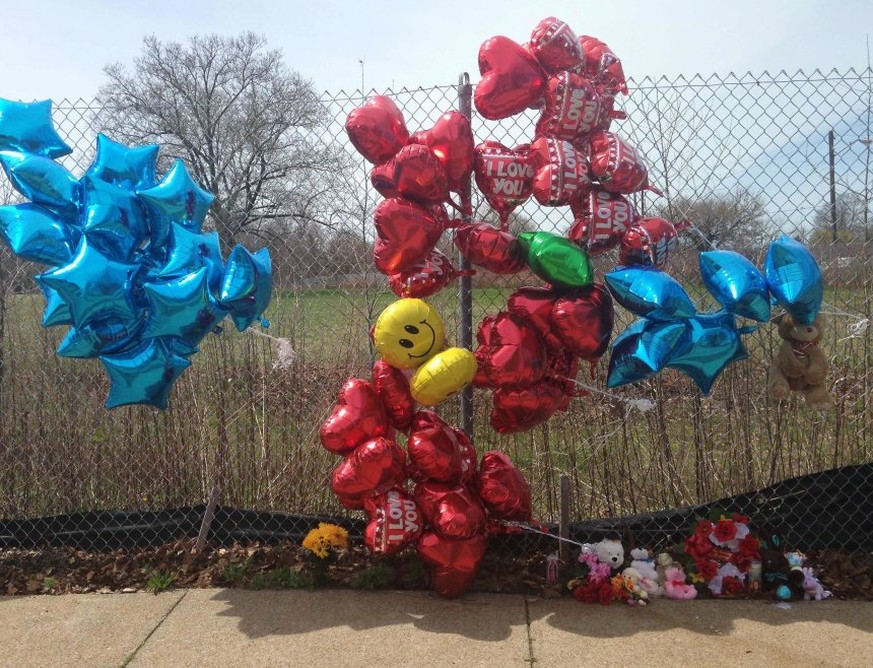 A makeshift memorial sits along a fence Monday, April 17, 2017, near where Robert Godwin Sr., was killed in Cleveland. Police said Steve Stephens killed Godwin on Sunday and posted the video on Facebo ...