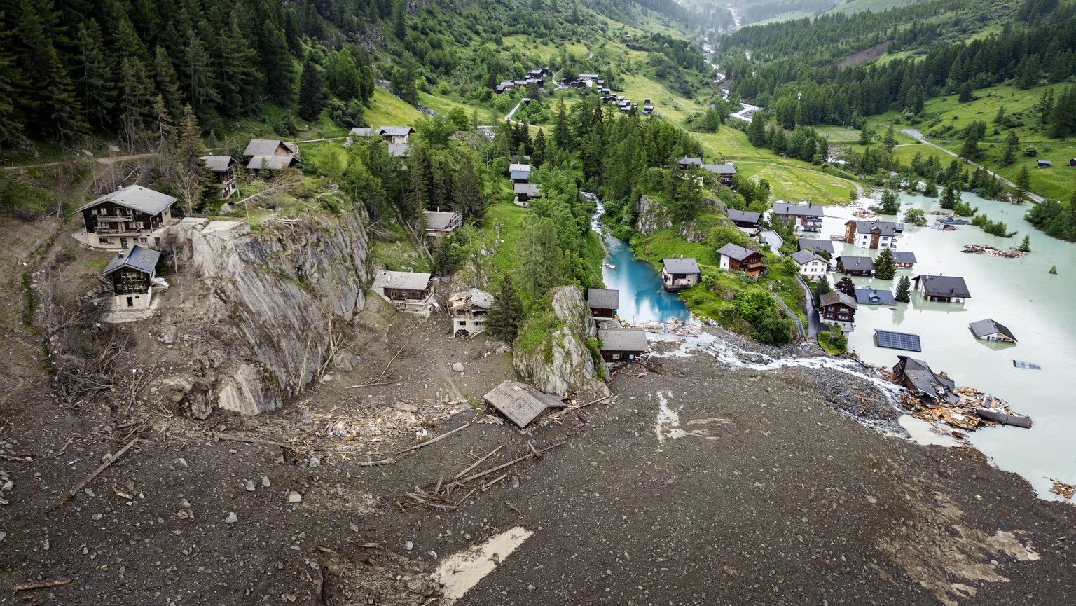 epaselect epa12160084 An aerial view shows houses devastated by the force of a massive avalanche triggered by the collapse of the Birch Glacier, which swept down to the valley floor and destroyed the  ...