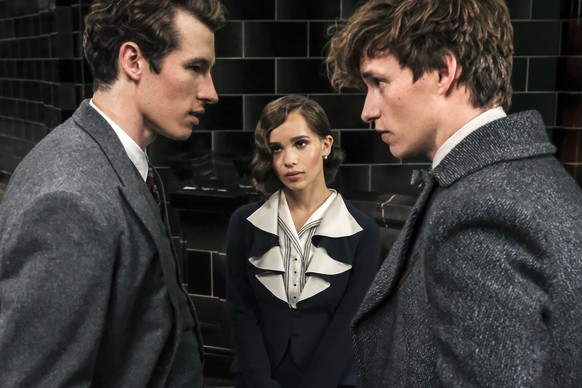 This image released by Warner Bros. Pictures shows Callum Turner, from left, Zoe Kravitz and Eddie Redmayne in a scene from &quot;Fantastic Beasts: The Crimes of Grindelwald.&quot; (Jaap Buitendijk/Wa ...