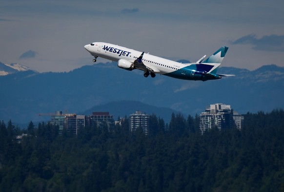 A WestJet Boeing 737 Max aircraft takes off from Vancouver International Airport in Richmond, British Columbia, Canada, on Friday, July 31, 2026. (Darryl Dyck/The Canadian Press via AP)
Canada-WestJet ...