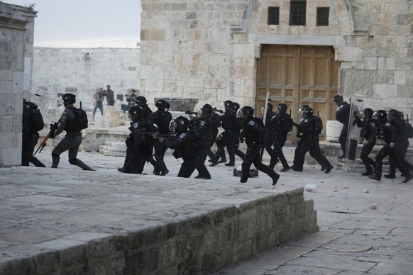 Israeli police enter the Al Aqsa Mosque compound where they clashed with Palestinian protesters following early morning prayers in Jerusalem&#039;s Old City, Friday, April 22, 2022. Israeli police and ...