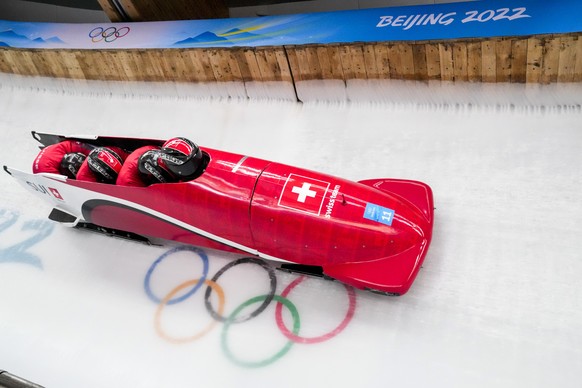 Michael Vogt, Luca Rolli, Cyril Bieri and Sandro Michel, of Switzerland, slide during the 4-man heat 3 at the 2022 Winter Olympics, Sunday, Feb. 20, 2022, in the Yanqing district of Beijing. (AP Photo ...