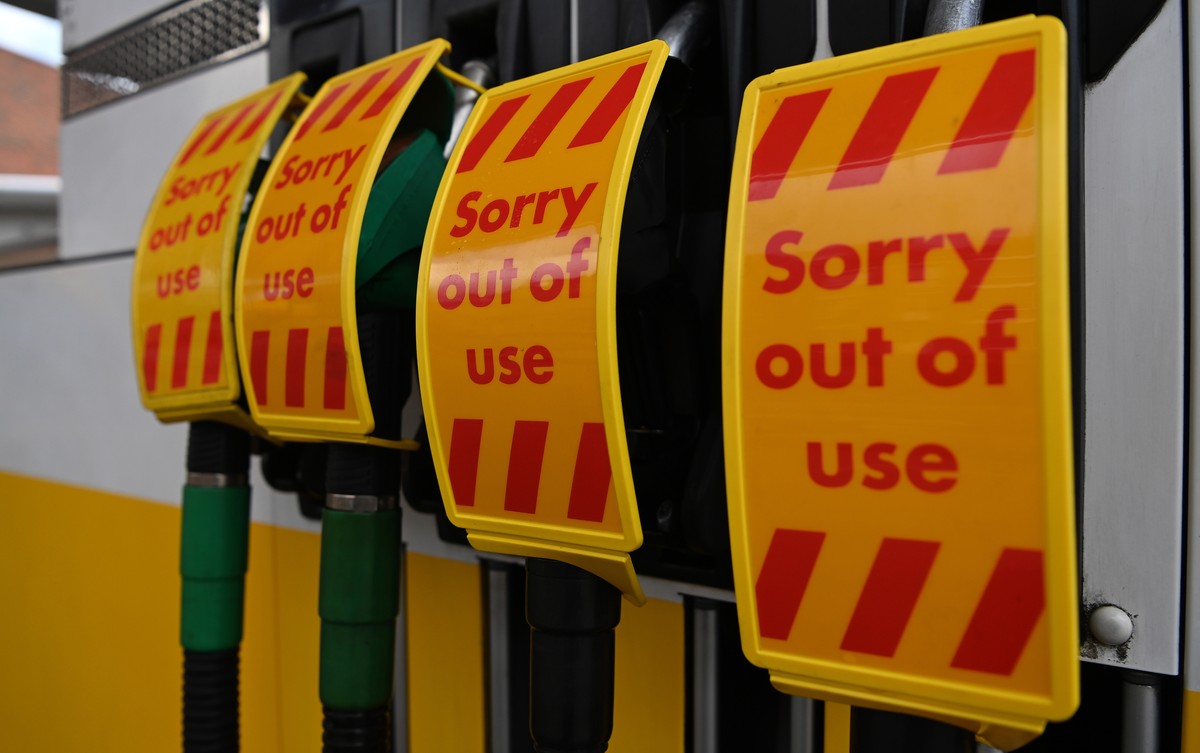 epa09506981 Signs reading 'Sorry out of use' are displayed on the pumps of a closed petrol station in London, Britain, 05 October 2021. Fuel prices in Britain have hit an eight-year high as  ...