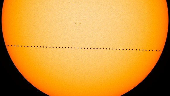 In this composite image provided by NASA, the planet Mercury passes directly between the sun and Earth on May 9, 2016 in a transit which lasted seven-and-a-half-hours. On Monday, Nov. 11, 2019, Mercur ...