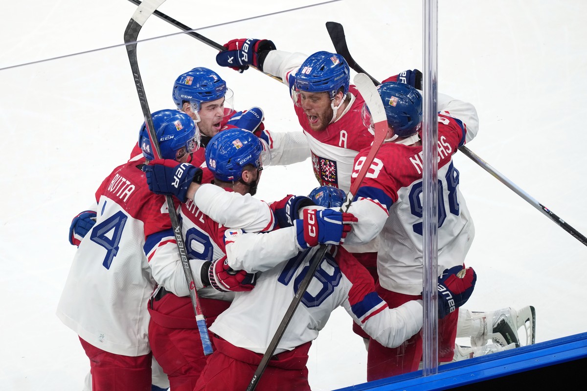 Team Czechia players celebrate after a goal by Ondrej Palat (18) during the third period of a men's ice hockey quarterfinal game at the 2026 Winter Olympics, in Milan, Italy, Wednesday, Feb. 18,  ...