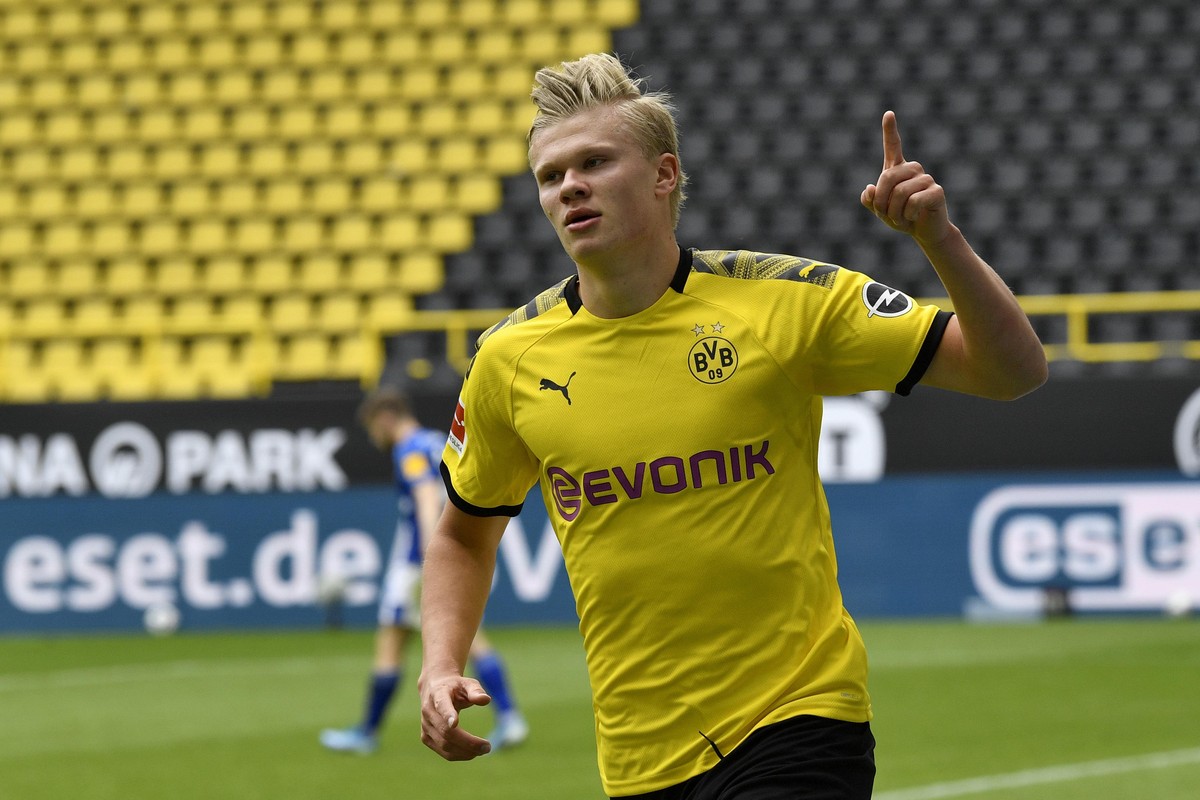 Dortmund's Erling Haaland celebrates after scoring the opening goal during the German Bundesliga soccer match between Borussia Dortmund and Schalke 04 in Dortmund, Germany, Saturday, May 16, 2020 ...