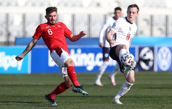 England v Switzerland - 2021 UEFA European Under-21 Championship - Group D - Bonifika Stadium Switzerland s Toni Domgjoni left and England s Oliver Skipp battle for the ball during the 2021 UEFA Europ ...
