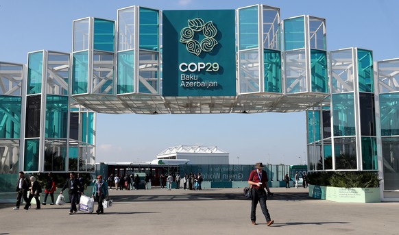 epa11712798 Participants arrive to attend the UN Climate Change Conference COP29 in Baku, Azerbaijan, 10 November 2024. The Azerbaijani capital of Baku will host the 2024 United Nations Climate Change ...