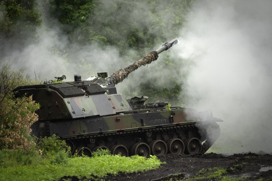 A Ukrainian army, German self-propelled Panzerhaubitze 2000 artillery fires toward Russian positions at the frontline near Bakhmut, Donetsk region, Ukraine, Saturday, May 27, 2023. (AP Photo/Efrem Luk ...