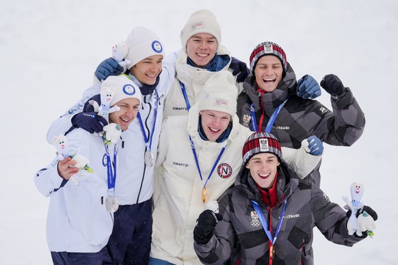 Silver medalists Eero Hirvonen and Ilkka Herola, of Finland, gold medalists Andreas Skoglund and Jens Luraas Oftebro, of Norway, and bronze medalists Stefan Rettenegger and Johannes Lamparter, of Aust ...